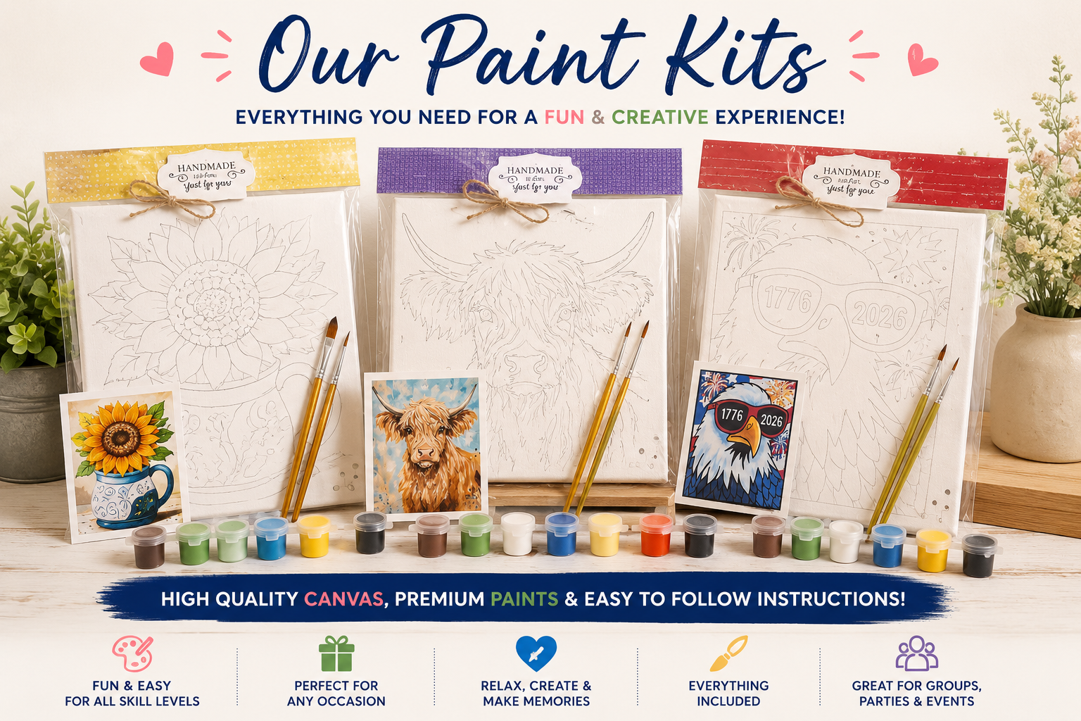 Paint kits with canvases, paints, and brushes on a white background